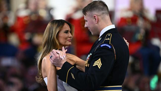 US First Lady Melania Trump dances with a member of the military at the Commander-In-Chief inaugural ball at the Walter E. Washington Convention Center in Washington, DC. Picture: AFP