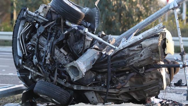 The mangled wreckage of the car at the scene. Picture: David Crosling