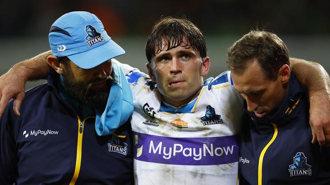 Aaron Booth of the Titans leaves the field with trainers during the round 21 NRL match between the Melbourne Storm and the Gold Coast Titans at AAMI Park, on August 05, 2022, in Melbourne, Australia. (Photo by Daniel Pockett/Getty Images)