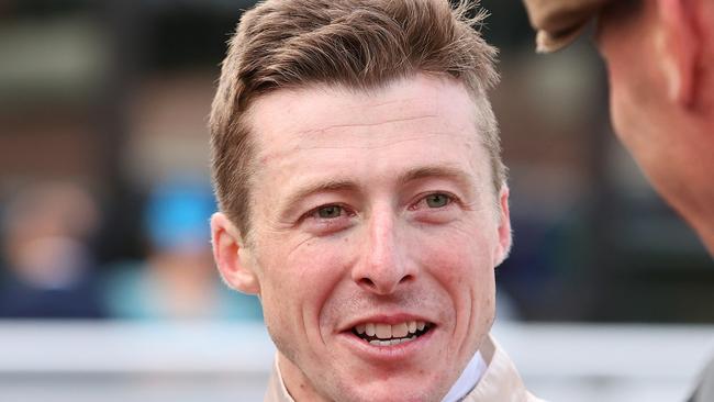 MELBOURNE, AUSTRALIA - OCTOBER 19: Jockey Harry Coffey is interviewed after riding Duke De Sessa to win race 9 the Sportsbet Caulfield Cup during Melbourne Racing at Caulfield Racecourse on October 19, 2024 in Melbourne, Australia. (Photo by Kelly Defina/Getty Images)