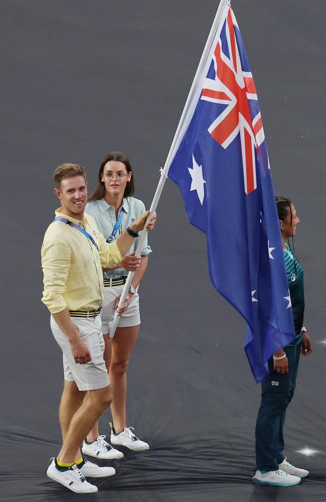 Flag-bearers Kaylee McKeown and Matt Wearn at the closing ceremony. Picture: Michael Klein