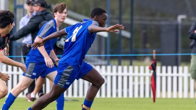 Storme Kapuya playing hard for Churchie’s First XI football team.