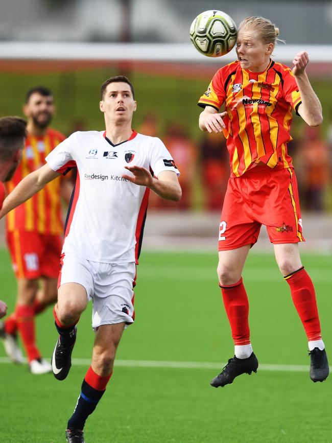 MetroStars’ Ben Head heads the ball during the match against South Adelaide on Saturday. Picture: AAP/Mark Brake