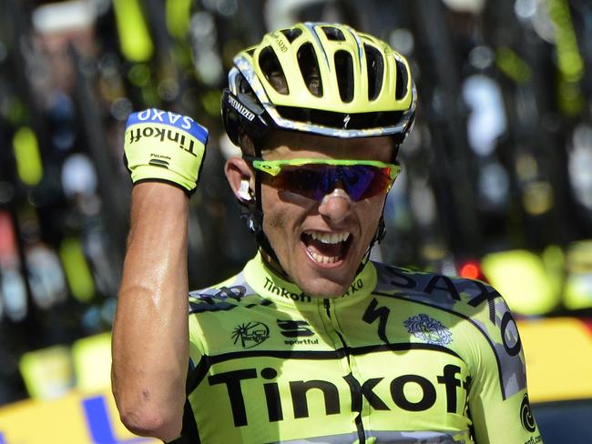 Poland's Rafal Majka celebrates as he crosses the finish line at the end of the 188 km eleventh stage of the 102nd edition of the Tour de France cycling race on July 15, 2015, between Pau and Cauterets, southwestern France. AFP PHOTO / JEFF PACHOUD