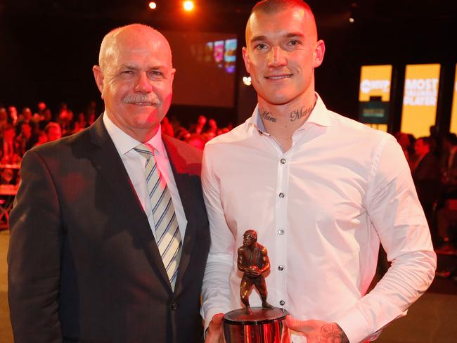 Dustin Martin with the Leigh Matthews trophy for AFLPA MVP, and the man himself.