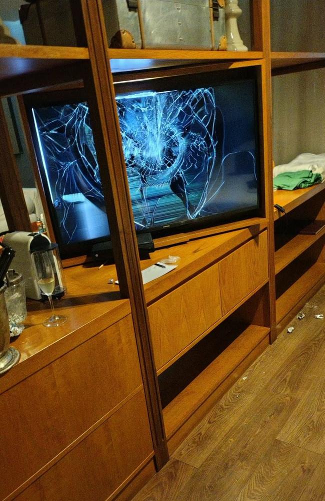 A TV with a broken screen and a half-full glass of champagne at the hotel room where late musician Liam Payne was staying in. Picture: Handout/Buenos Aires Police/AFP