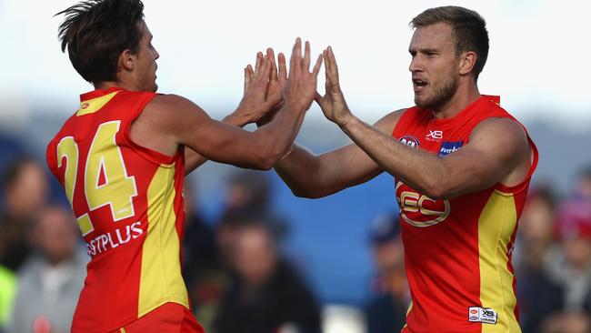 Sam Day celebrates a goal with David Swallow.