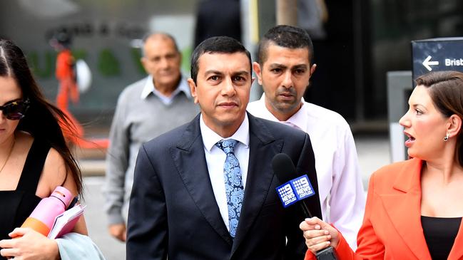 Gold Coast mortgage broker George Boulos (centre) arrives at the Supreme Court in Brisbane. Picture: NCA NewsWire / Dan Peled