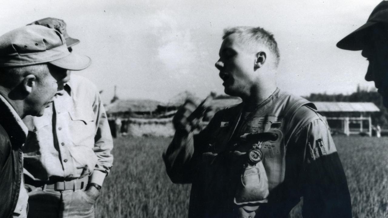 Navy pilot Neil Armstrong (centre) after his Grumman F9F-2 Panther was shot down in Korea in 1951. Picture: US Navy