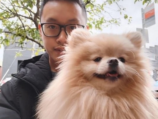 Mr Chow with Kobe the dog.