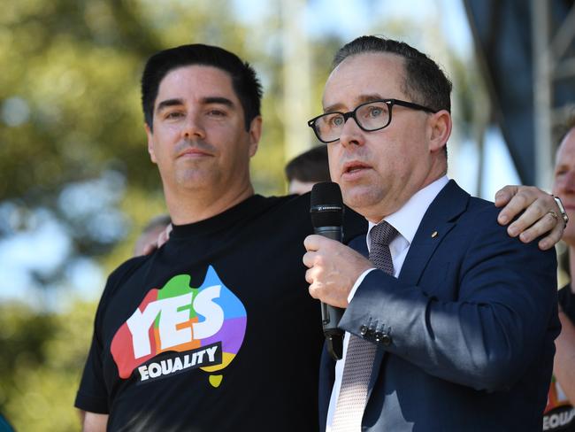 Alan Joyce, the CEO of Qantas, stands with his partner as he speaks after watching the same sex marriage vote result announcement during a picnic held by the Equality Campaign at Prince Regent Park in Sydney, Wednesday, November 15, 2017. Picture: AAP Image/David Moir