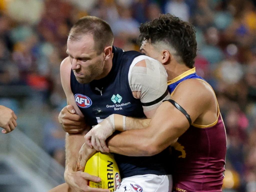 Sam Docherty is tackled by Cam Rayner during the opening term of Carlton and Brisbane’s Opening Round clash in Brisbane. Picture: Russell Freeman/AFL Photos via Getty Images.