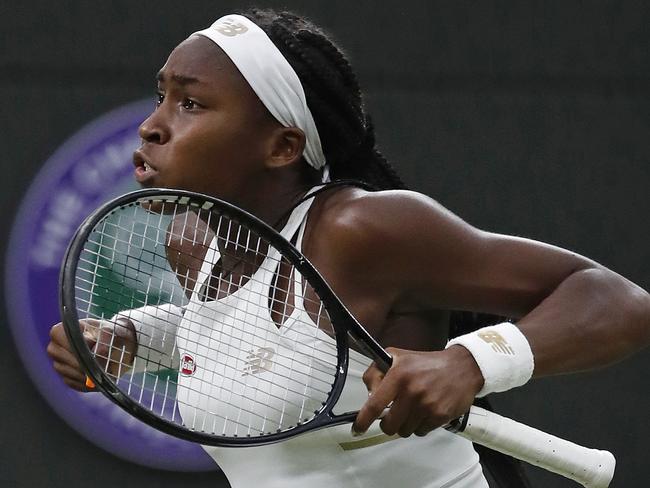 United States' Cori "Coco" Gauff celebrates after beating Slovakia's Magdalena Rybaikova in a Women's singles match during day three of the Wimbledon Tennis Championships in London, Wednesday, July 3, 2019. (AP Photo/Alastair Grant)