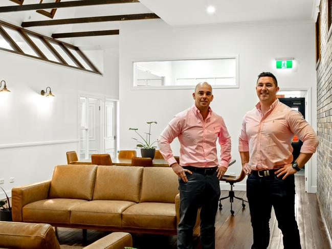 FOR SALE: LJ Hooker's Markus Eames and Dan Cullinane stand inside 300 Ruthven St, Toowoomba CIty.