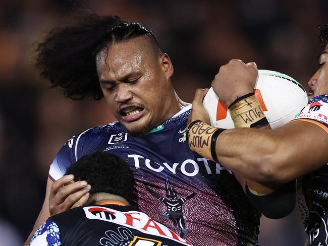 SYDNEY, AUSTRALIA - MAY 20:  Luciano Leilua of the Cowboys is tackled during the round 12 NRL match between Wests Tigers and North Queensland Cowboys at Leichhardt Oval on May 20, 2023 in Sydney, Australia. (Photo by Matt King/Getty Images)