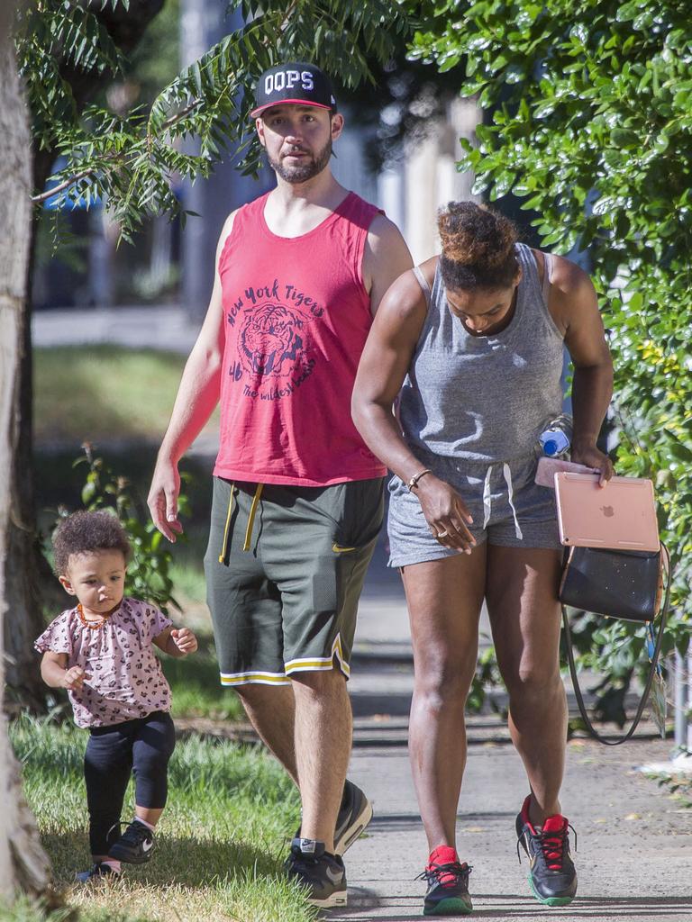 Serena Williams and her husband Alexis Ohanian enjoy an afternoon walk with their 1-year-old daughter Alexia Olympia. Serena's daughter looked seriously cute, toddling her way down the footpath, wearing Nike sneakers like her Mummy. Picture: MediaMode