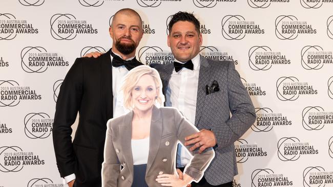 Byron Cooke and Brendan Fevola with a cardboard cutout of their co-host Fifi Box at the ACRAs in 2019. Picture: Supplied.