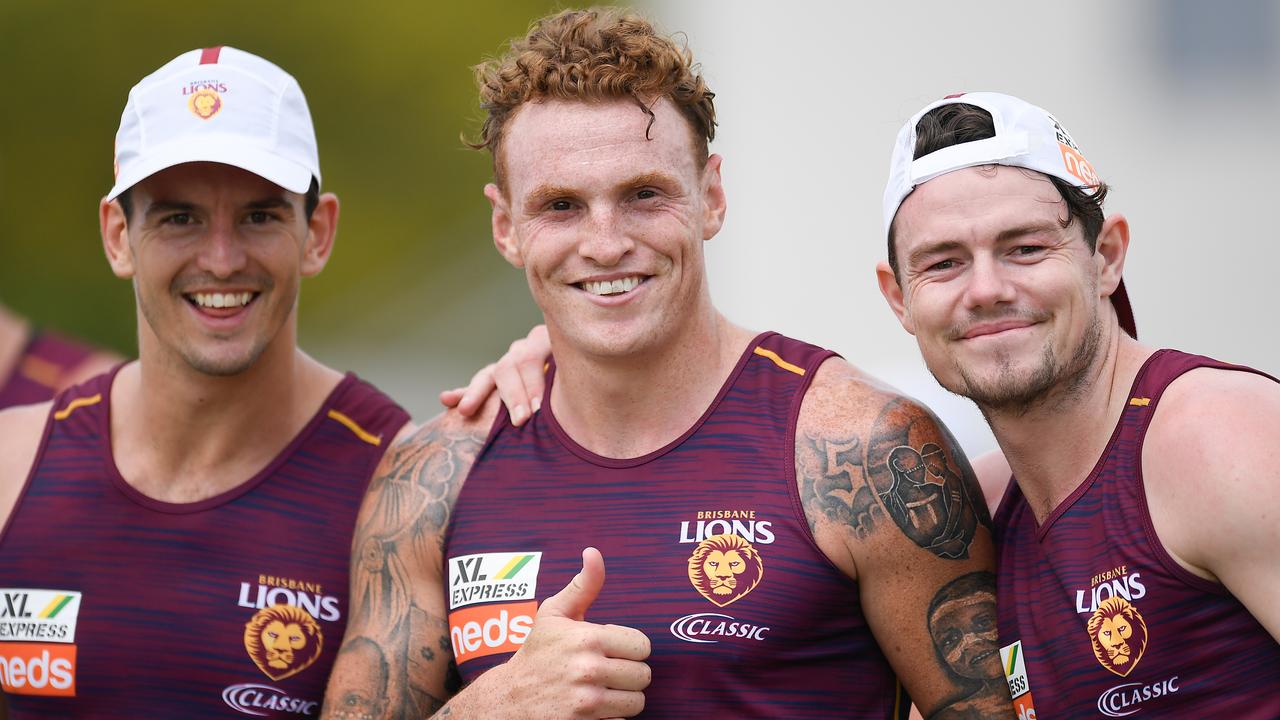 (L-R) Jarryd Lyons, Mitch Robinson and Lachie Neale pose for a photo during a Brisbane Lions training session at Leyshon Park in Brisbane, Monday, November 18, 2019. (AAP Image/Albert Perez) NO ARCHIVING