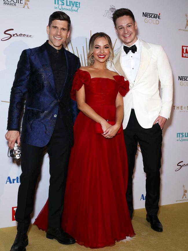 Loves a media wall: TV host Osher Gunsberg, Bachelorette Angie Kent and Bachelor Matt Agnew. Picture: Matrix