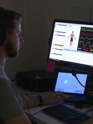 An AHS trechnician monitors the simulation suite