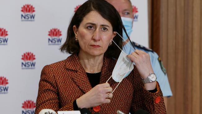 NSW Premier Gladys Berejiklian removes a face mask to speak during a Covid-19 update in Sydney. Picture: Getty