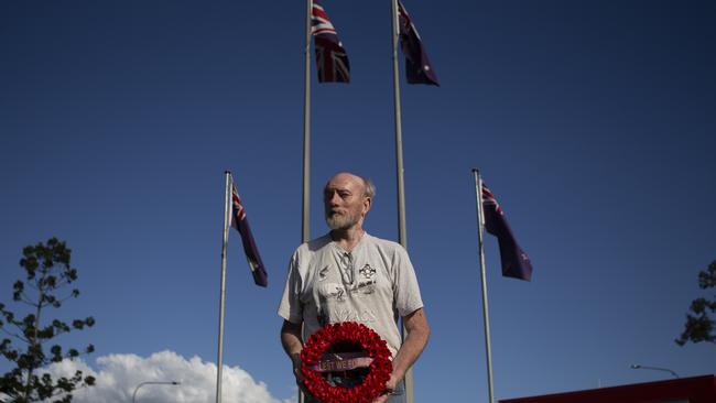 Mic Noble at the Logan war memorial, where the service was cancelled but he organised a video tribute. (AAP/Image Sarah Marshall)