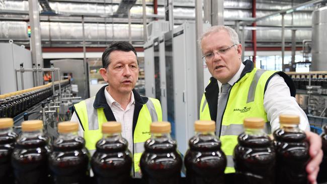 Bickford's Managing Director Angelo Kotses, pictured with Prime Minister Scott Morrison, is says his distillery project for Kingscote is on hold until he learns more about the export plan. Picture: AAP /David Mariuz