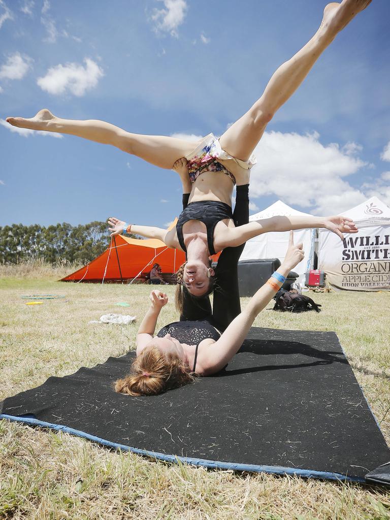 Carley Fuller holds Cara Myers whilst training for their circus workshops at the 2019 Cygnet Folk Festival. Picture: MATHEW FARRELL