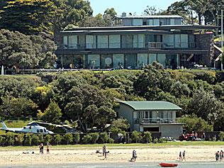 Lindsay Fox's Portsea mansion towers over the helipad and boathouse. Picture: Mark Smith