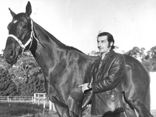 Rick Renzella, owner of Royal School, points to the brand on the horse to try to prove that it is actually the same horse.