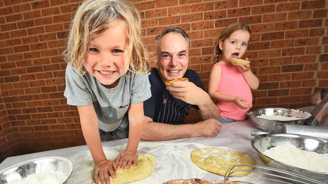 Austin and Zahlia have a try at making some pies with Melbourne chef Ray Capaldi. Picture: Tony Gough