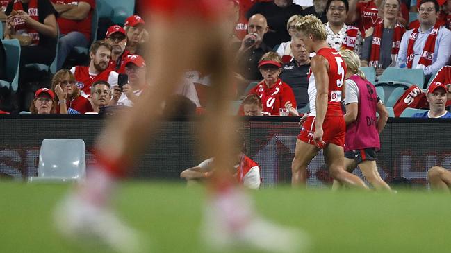 Isaac Heeney after injuring his hand against Essendon. Picture: Getty Images