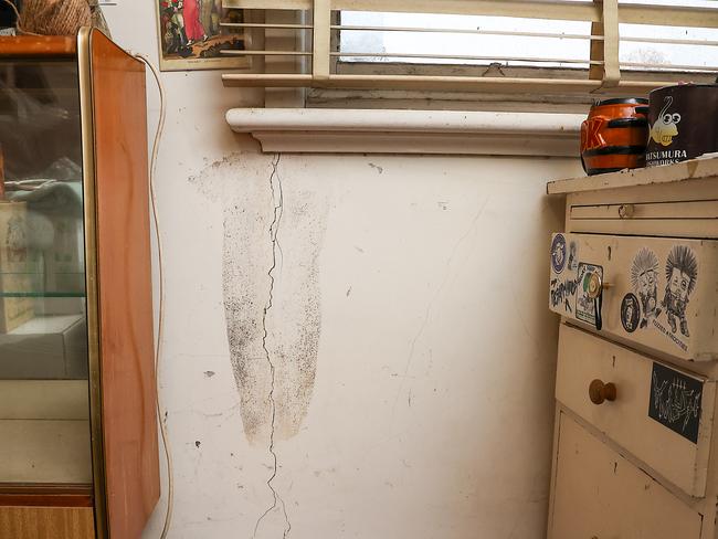 Cracks and mould can be seen in a bedroom. Picture: Ian Currie