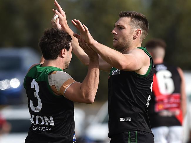 Jacob Thompson (right) of Greenvale reacts during the EDFL foot match at Greenvale Rec Reserve, Melbourne, Saturday, April 6, 2019. EDFL footy: Greenvale v Pascoe Vale. (AAP Image/James Ross) NO ARCHIVING