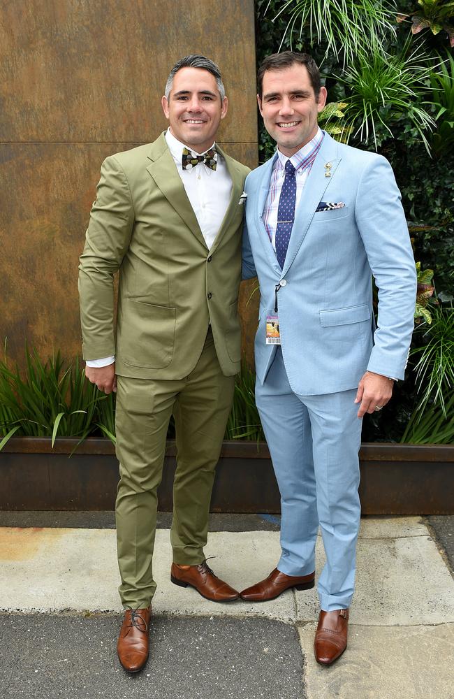 NRL players Corey Parker and Cameron Smith pose for photographs in the Birdcage on Melbourne Cup Day at Flemington Racecourse, in Melbourne, Tuesday, Nov. 3, 2015. (AAP Image/Dan Himbrechts)