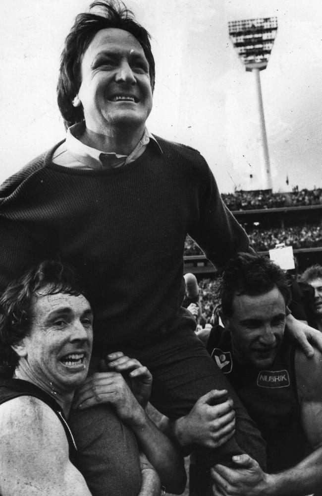 Terry Daniher and Tim Watson carry Kevin Sheedy off the MCG after the 1984 Grand Final.