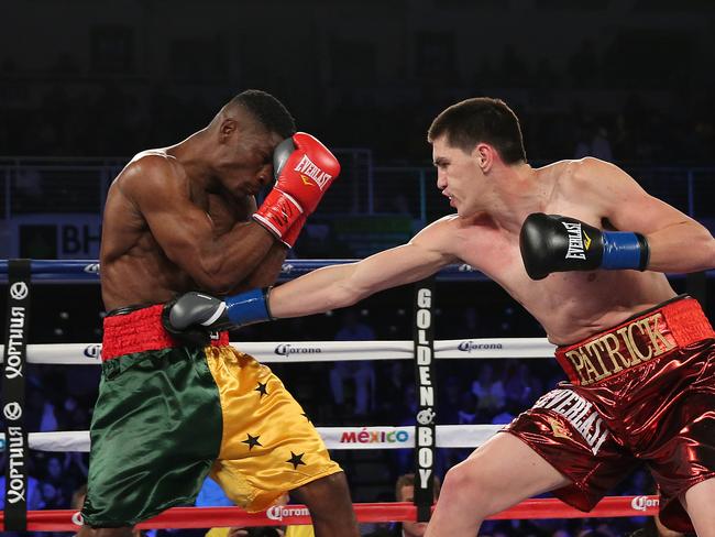 Patrick Teixeira (right) throws a right hand against middleweight Patrick Allotey. (Photo by Alex Menendez/Getty Images)