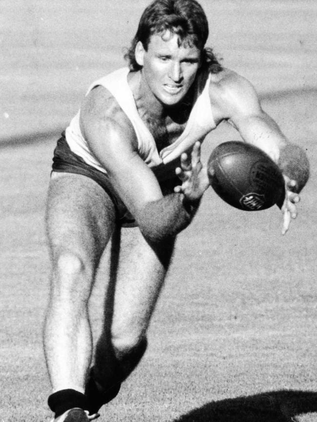 Scott Hodges takes a mark during preseason training at Max Basheer Reserve in 1991. 