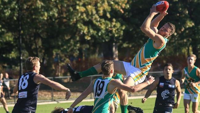 PICTURE OF THE WEEK: Mooroolbark’s Paul Thatcher takes a screamer in the Eastern Football League. Picture: Davis Harrigan.