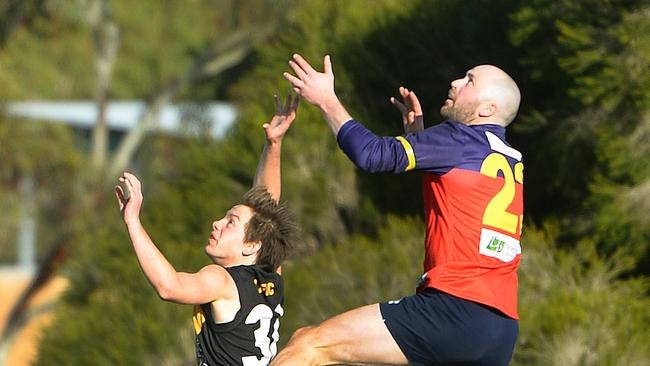 RDFL footy: Diggers Rest V Lancefield. Diggers Cole Laurie over Tim Vandervalk.