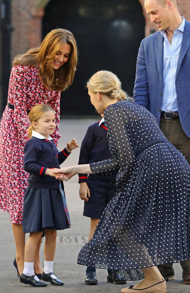 Helen Haslem, head of the lower school greets Princess Charlotte as she arrives for her first day of school. Picture: Aaron Chown