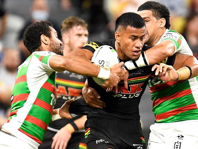 TOWNSVILLE, AUSTRALIA - SEPTEMBER 11:  Stephen Crichton of the Panthers is tackled by Alex Johnston and Cody Walker of the Rabbitohs during the NRL Qualifying Final match between Penrith Panthers and South Sydney Rabbitohs at QCB Stadium, on September 11, 2021, in Townsville, Australia. (Photo by Ian Hitchcock/Getty Images)