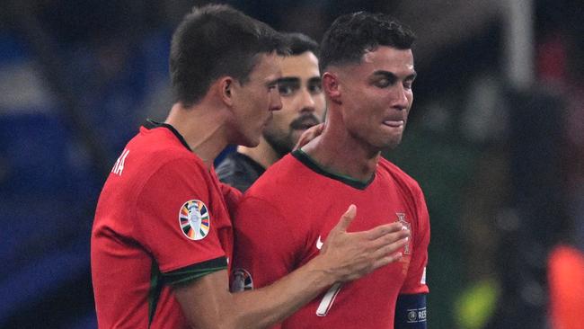 Portugal's Cristiano Ronaldo, right, after missing a penalty against Slovenia. Picture: AFP