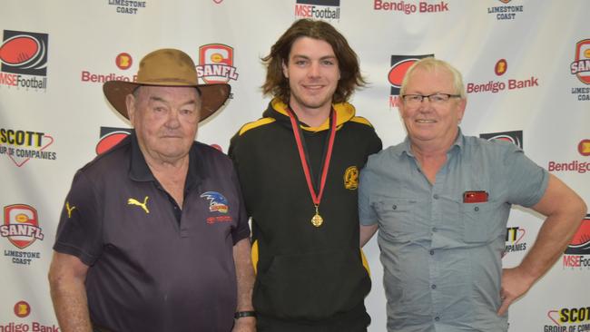 Ian (Ned) Walker was killed a head-on car crash alongside wife Nan and daughter Sue Skeer. Picture with Harry Evans 2019 Walker Medallist and son Wayne Walker. Picture: Mid South Eastern Football League