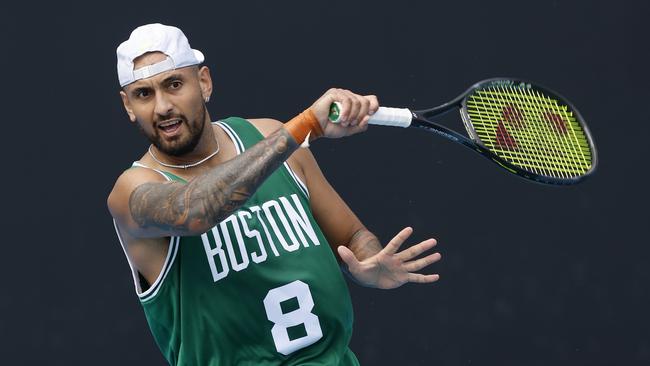 Nick Kyrgios practised in a Boston Celtics jersey at Melbourne Park on Friday ahead of his grand slam return on Monday. Picture: Michael Klein