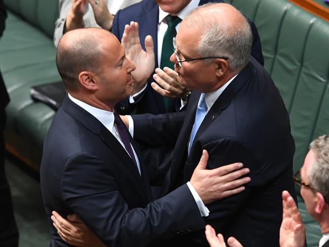 Treasurer Josh Frydenberg is congratulated by Prime Minister of Australia Scott Morrison after delivering the Budget in the House of Representatives. Picture: Getty Images