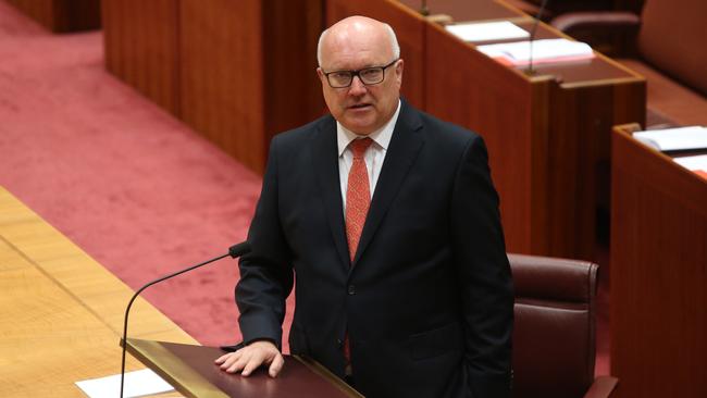 Senator George Brandis has fired a parting shot at the LNP merger.