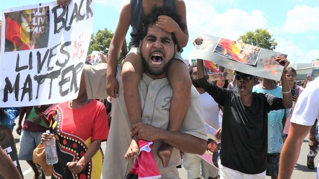 Algen Donahue, the brother of Aubrey Donahue, leads a march through the streets of Mareeba after his twin brother was shot dead on Saturday. Picture: Peter Carruthers