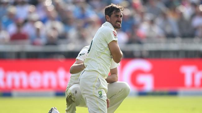 Mitchell Starc of Australia holds his shoulder after picking up an injury. Picture: Getty Images.