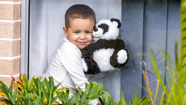 Four-year-old Hudson Grunberger with his teddy bear at his Caboolture South home. Picture: AAP/Richard Walker